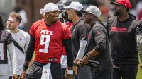 Atlanta Falcons quarterback Michael Penix Jr. (9) and head coach Raheem Morris on the field during Minicamp at Children's Healthcare of Atlanta Training Ground.