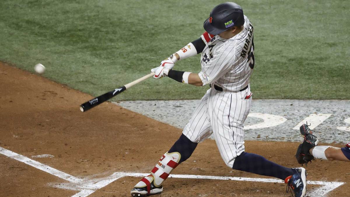 Japan third baseman Munetaka Murakami (55) hits a home run against the USA in the second inning at LoanDepot Park.
