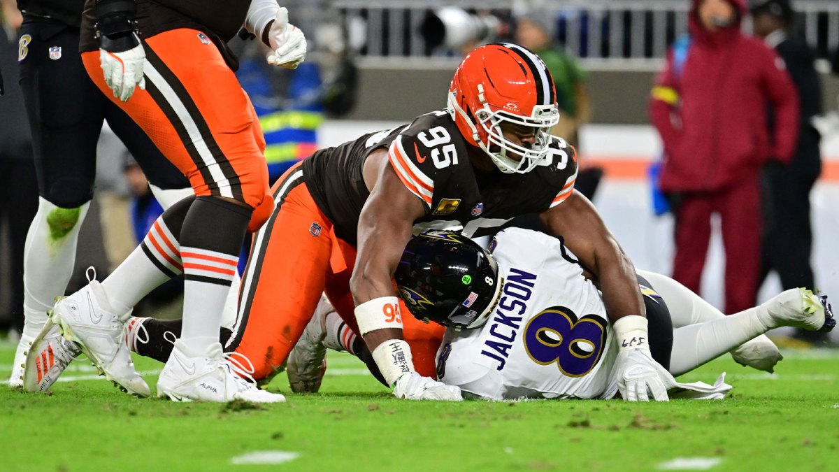 Cleveland Browns defensive end Myles Garrett (95) reacts after sacking Baltimore Ravens quarterback Lamar Jackson (8) during the second quarter at Huntington Bank Field. Mandatory Credit: Ken Blaze-Imagn Images