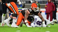 Cleveland Browns defensive end Myles Garrett (95) reacts after sacking Baltimore Ravens quarterback Lamar Jackson (8) during the second quarter at Huntington Bank Field. Mandatory Credit: Ken Blaze-Imagn Images