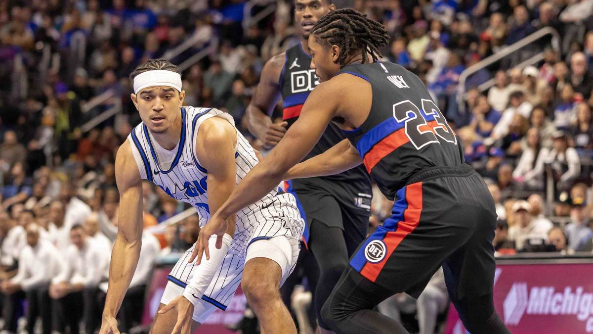 Detroit Pistons guard Jaden Ivey (23) defends against Orlando Magic guard Anthony Black (0) during the first quarter at Little Caesars Arena.