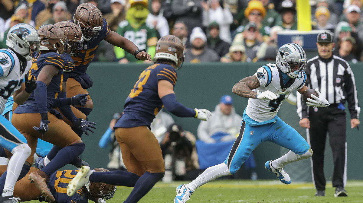 Carolina Panthers wide receiver Tetairoa McMillan (4) runs the ball after making a reception against the Green Bay Packers during the game at Lambeau Field.