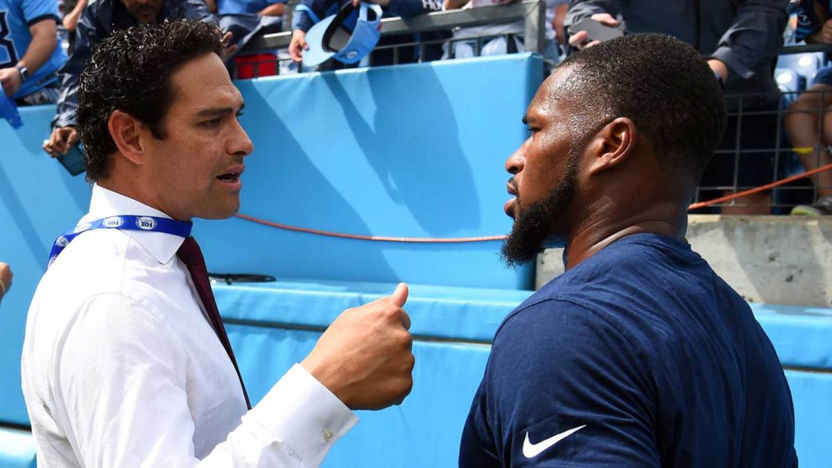 Fox Sports analyst and former NFL quarterback Mark Sanchez talks with Tennessee Titans safety Kevin Byard (31) before the game against the New York Giants at Nissan Stadium.