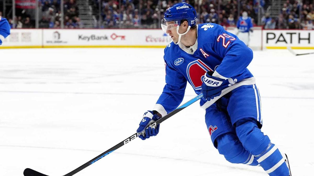 Colorado Avalanche center Nathan MacKinnon (29) controls the puck in the second period against the Montreal Canadiens at Ball Arena.