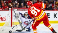 Calgary Flames center Nazem Kadri (91) scores a goal against Columbus Blue Jackets goaltender Jet Greaves (73) during the second period at Scotiabank Saddledome.