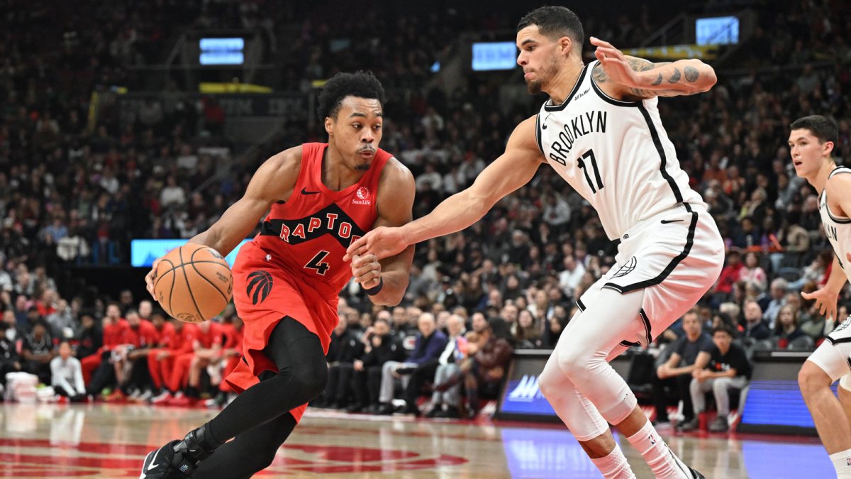 Toronto Raptors forward Scottie Barnes (4) dribbles the ball against Brooklyn Nets forward Michael Porter Jr. (17) in the second half at Scotiabank Arena.