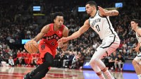 Toronto Raptors forward Scottie Barnes (4) dribbles the ball against Brooklyn Nets forward Michael Porter Jr. (17) in the second half at Scotiabank Arena.