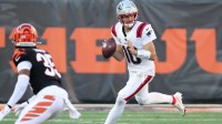 New England Patriots quarterback Drake Maye (10) rolls out during the second half against the Cincinnati Bengals at Paycor Stadium.