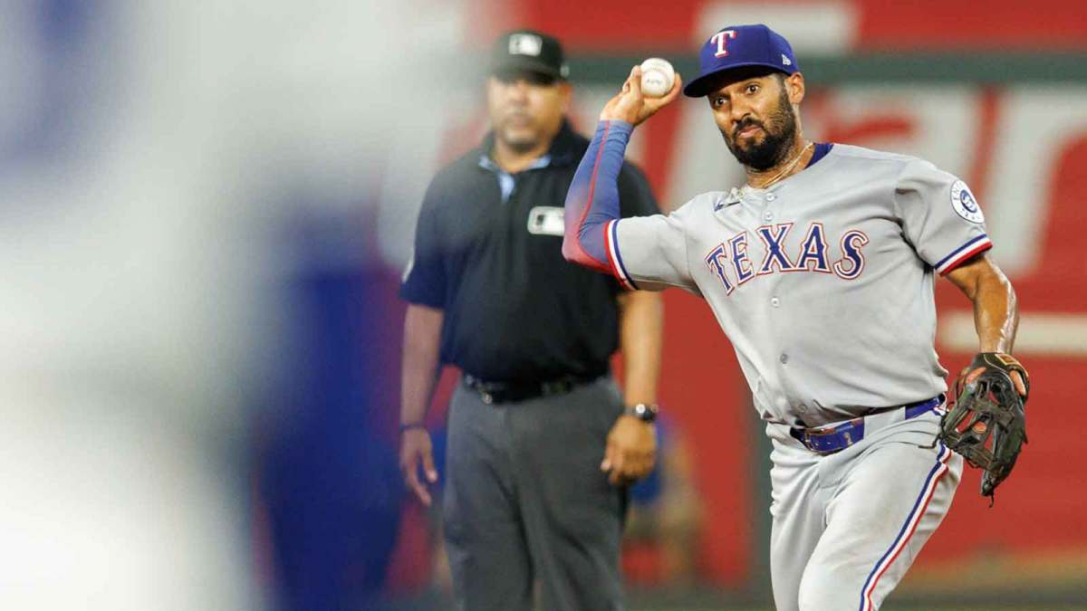 Texas Rangers second base Marcus Semien (2) throws to first base during the ninth inning against the Kansas City Royals at Kauffman Stadium.