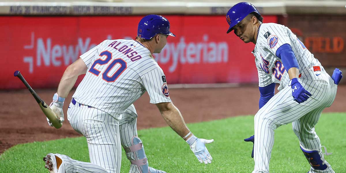 New York Mets right fielder Juan Soto (22) is greeted by first baseman Pete Alonso (20) after hitting a two run home run in the second inning against the Atlanta Braves at Citi Field.