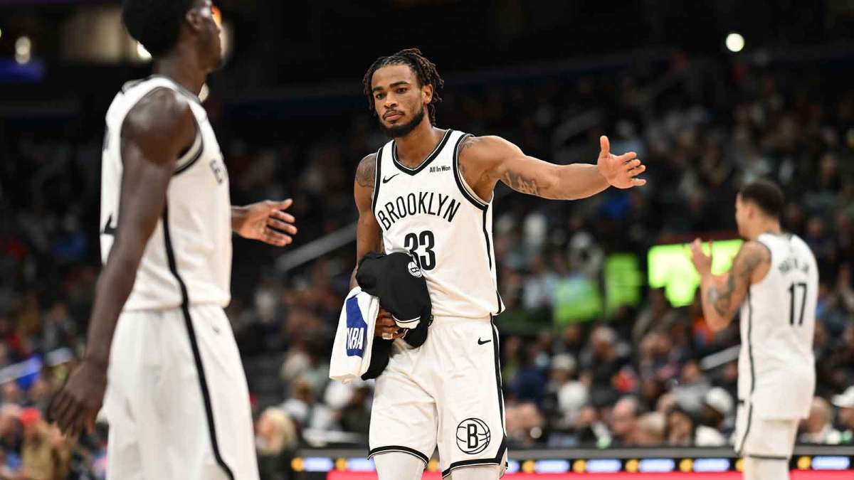 Nov 16, 2025; Washington, District of Columbia, USA; Brooklyn Nets center Nic Claxton (33) celebrates with guard Drake Powell (4) during a time out against the Washington Wizards during the fourth quarter at Capital One Arena. Mandatory Credit: Rafael Suanes-Imagn Images