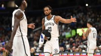 Nov 16, 2025; Washington, District of Columbia, USA; Brooklyn Nets center Nic Claxton (33) celebrates with guard Drake Powell (4) during a time out against the Washington Wizards during the fourth quarter at Capital One Arena. Mandatory Credit: Rafael Suanes-Imagn Images
