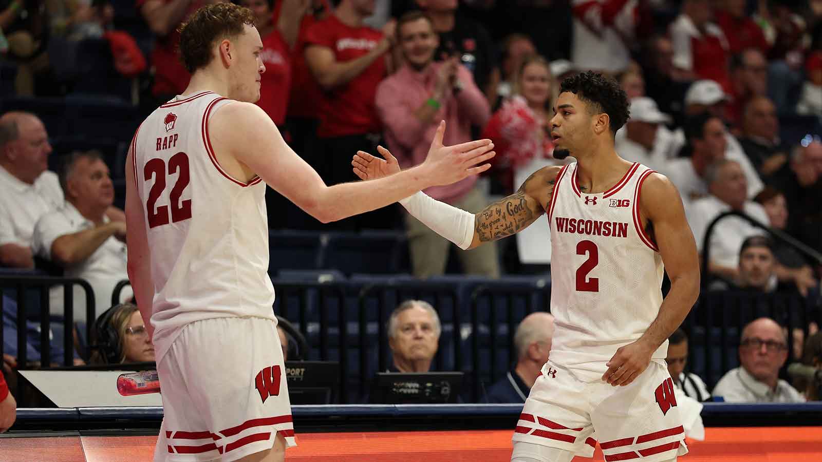Wisconsin Badgers guard Nick Boyd (2) reacts with Wisconsin Badgers forward Austin Rapp (22) after scoring against the Providence Friars during the second half at Jenny Craig Pavilion.