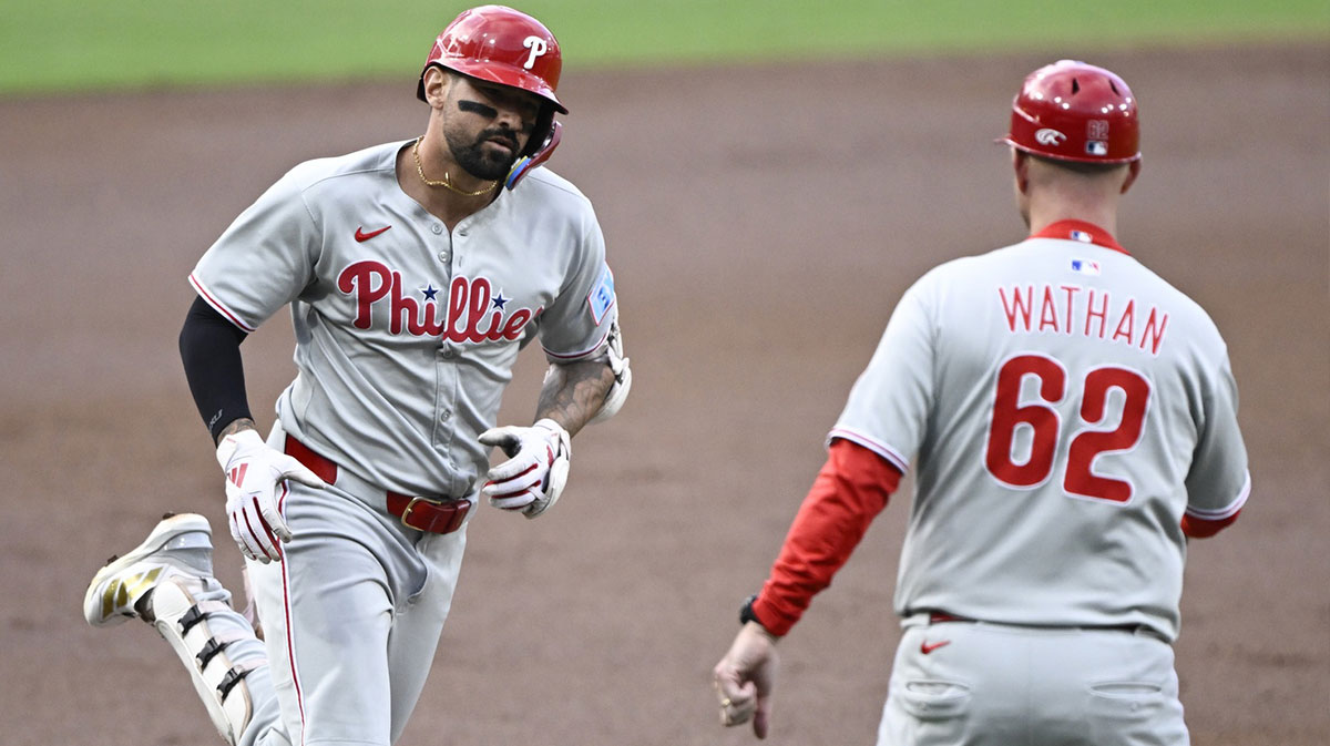 Philadelphia Phillies right fielder Nick Castellanos (8) is congratulated by Dusty Wathan (62) after hitting a solo home run during the second inning against the San Diego Padres at Petco Park.