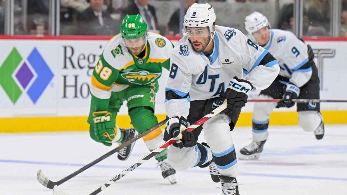 Utah Mammoth forward Nick Schmaltz (8) controls the puck as Minnesota Wild forward Ryan Hartman (38) gives chase during the third period at Grand Casino Arena.