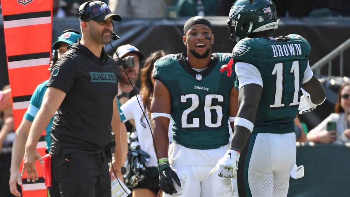 Philadelphia Eagles head coach Nick Sirianni and running back Saquon Barkley (26) celebrate touchdown catch by wide receiver A.J. Brown (11) against the Cleveland Browns during the second quarter at Lincoln Financial Field.