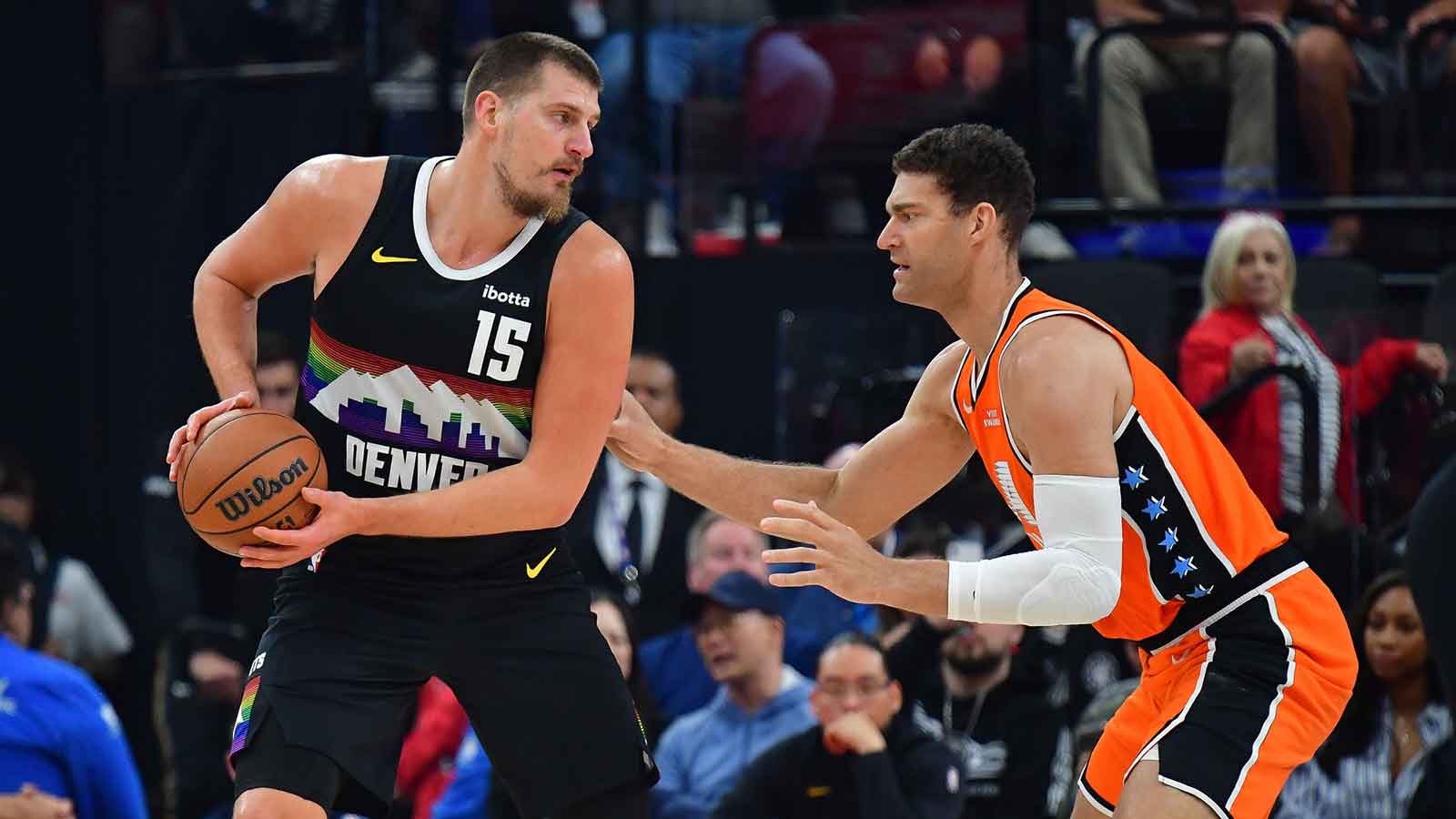 Denver Nuggets center Nikola Jokic (15) moves the ball against Los Angeles Clippers center Brook Lopez (11) during the first half at Intuit Dome.