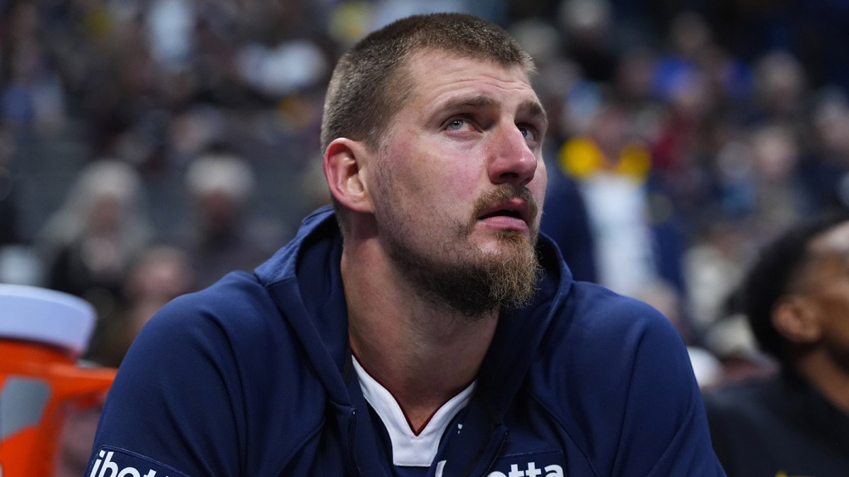 Denver Nuggets center Nikola Jokic (15) on the bench in the fourth quarter against the Indiana Pacers at Ball Arena.