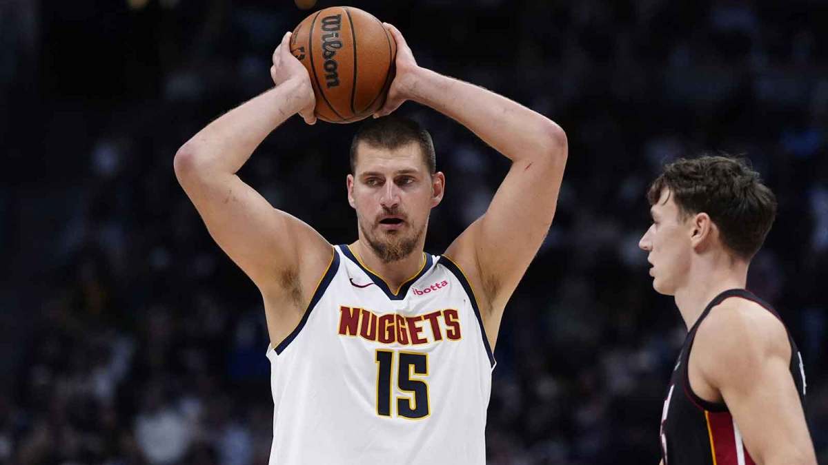 Denver Nuggets center Nikola Jokic (15) prepares to pass the ball in the second quarter against the Miami Heat at Ball Arena.