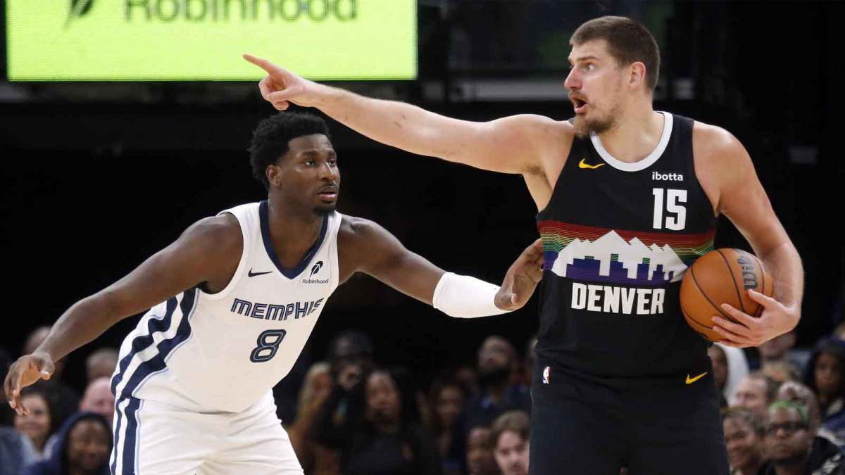 Denver Nuggets center Nikola Jokic (15) handles the ball as Memphis Grizzlies forward/center Jaren Jackson Jr. (8) defends during the fourth quarter at FedExForum.