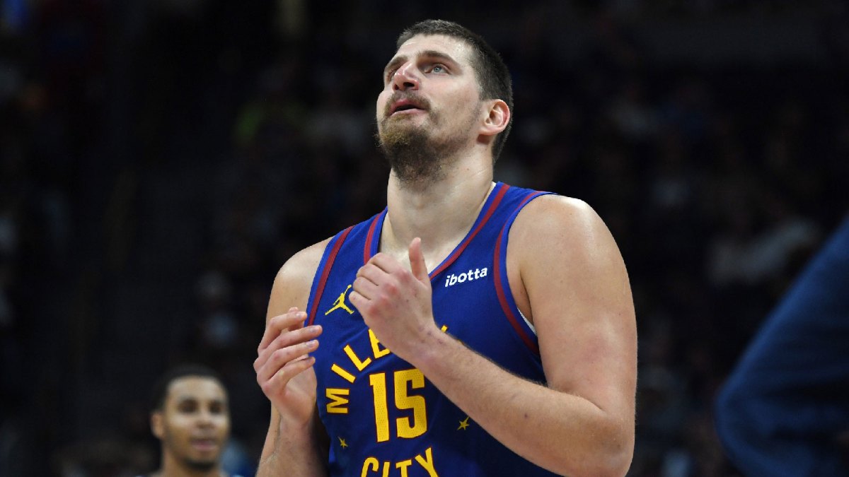 Denver Nuggets center Nikola Jokic (15) walks back to the bench during a timeout while trailing during the second half against the Sacramento Kings at Ball Arena.
