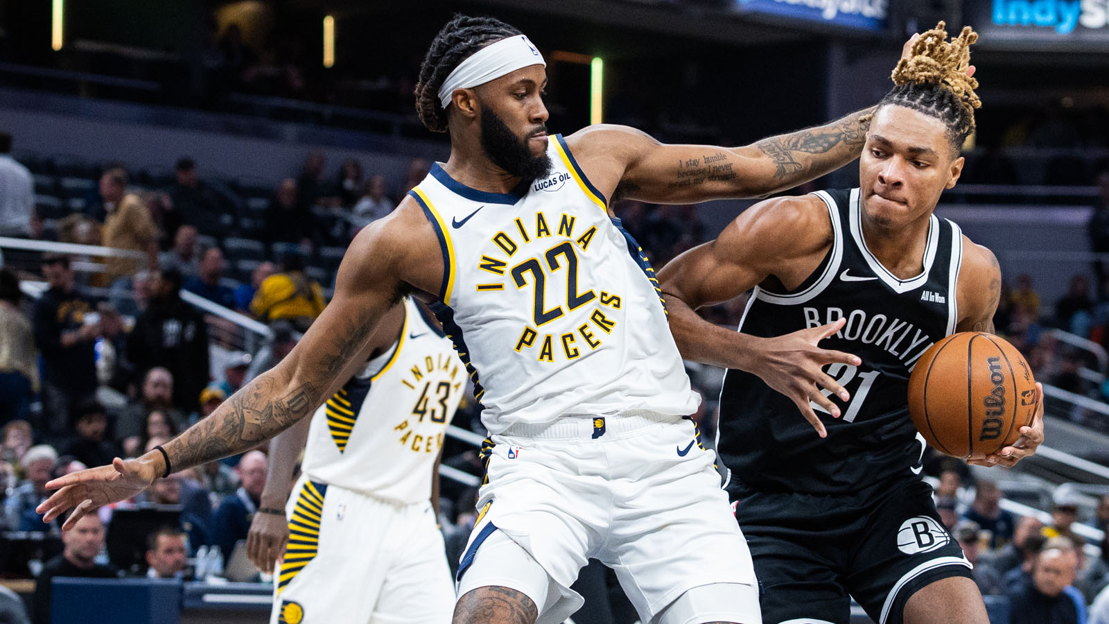 Brooklyn Nets forward/center Noah Clowney (21) dribbles the ball while Indiana Pacers forward Isaiah Jackson (22) defends in the second half at Gainbridge Fieldhouse.