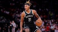 Brooklyn Nets forward Noah Clowney (21) handles the ball against the Houston Rockets during the third quarter at Toyota Center.