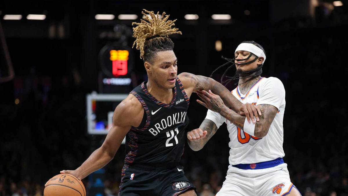 Brooklyn Nets forward Noah Clowney (21) dribbles against New York Knicks guard Jordan Clarkson (00) during the second half at Barclays Center.