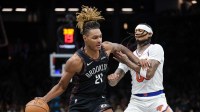 Brooklyn Nets forward Noah Clowney (21) dribbles against New York Knicks guard Jordan Clarkson (00) during the second half at Barclays Center.