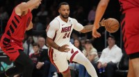 Miami Heat guard Norman Powell (24) drives past Portland Trail Blazers forward Deni Avdija (8) in the first quarter at Kaseya Center.