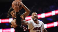 Philadelphia 76ers forward Dominick Barlow (25) battles for the ball against Miami Heat guard Norman Powell (24) in the fourth quarter at Xfinity Mobile Arena.