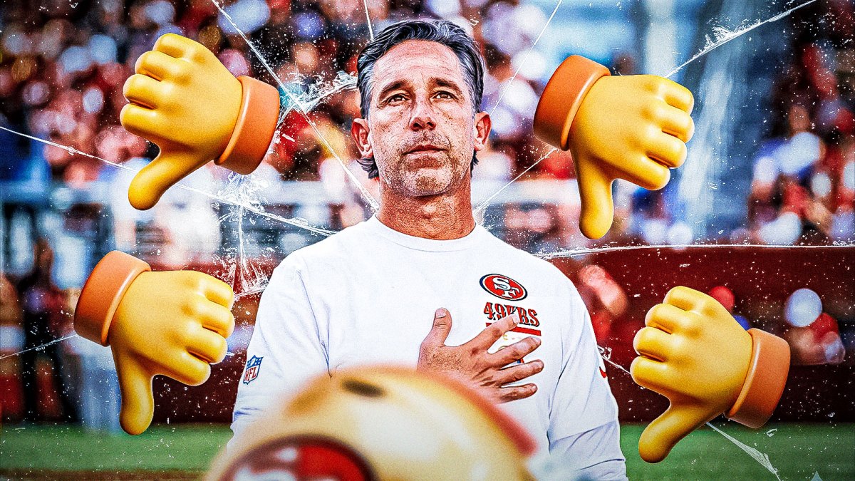 Kyle Shanahan, Odell Beckham Jr beside each other, 49ers wallpaper in the background with ❓ emojis all over