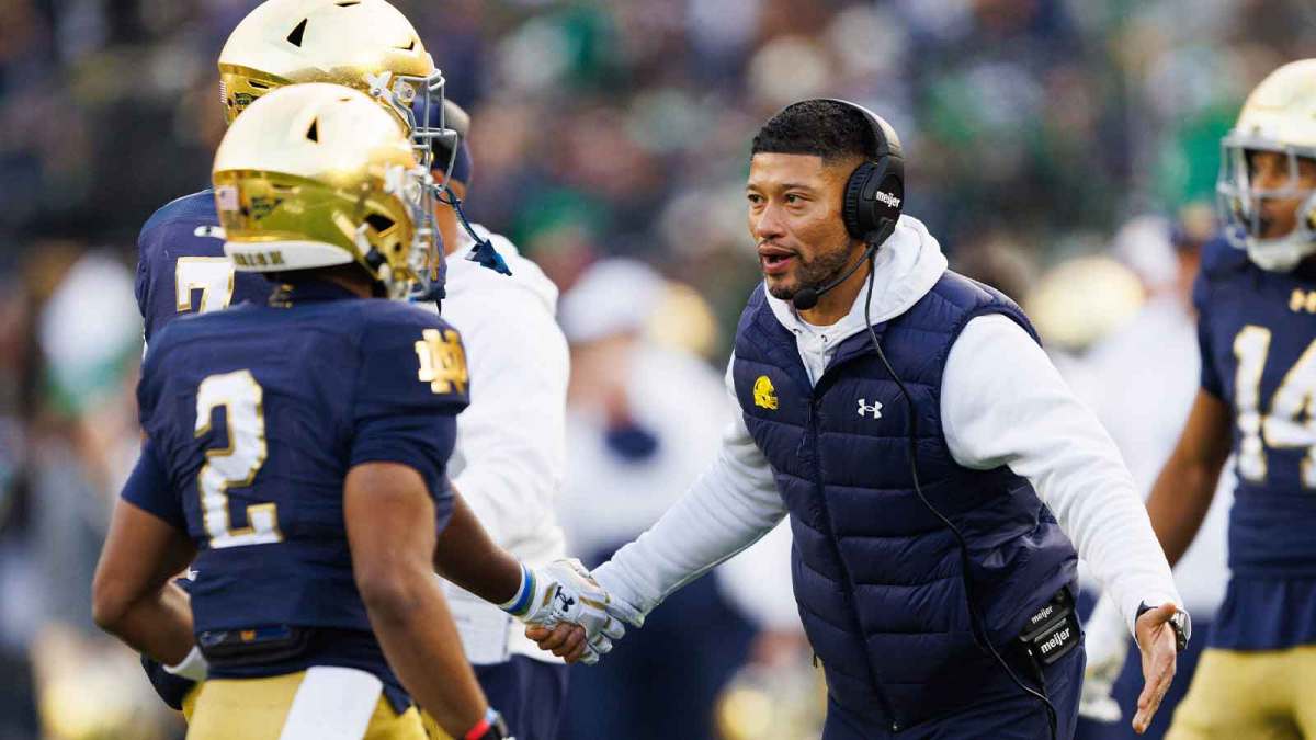 Notre Dame head coach Marcus Freeman celebrates after a touchdown in the first half of a NCAA football game against Syracuse at Notre Dame Stadium
