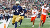 Notre Dame running back Jeremiyah Love (4) runs the ball into the end zone for a touchdown in the first half of a NCAA football game against Syracuse at Notre Dame Stadium on Saturday, Nov. 22, 2025, in South Bend.