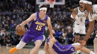 Los Angeles Lakers guard Austin Reaves (15) drives towards the basket during the fourth quarter against the Milwaukee Bucks at Fiserv Forum. Mandatory Credit: Jeff Hanisch-Imagn Images