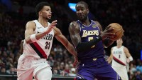 Los Angeles Lakers center Deandre Ayton (5) drives to the basket during the second half against Portland Trail Blazers forward Toumani Camara (33) at Moda Center. Mandatory Credit: Troy Wayrynen-Imagn Images
