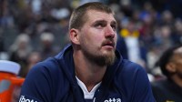 Denver Nuggets center Nikola Jokic (15) on the bench in the fourth quarter against the Indiana Pacers at Ball Arena.