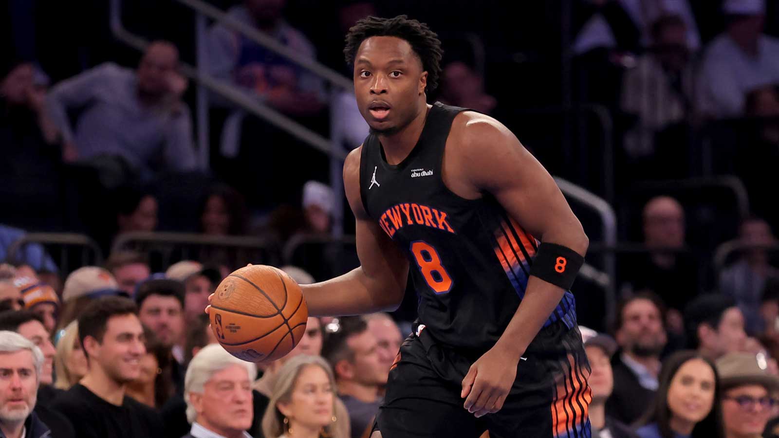 New York Knicks forward OG Anunoby (8) brings the ball up court against the Miami Heat during the first quarter at Madison Square Garden.