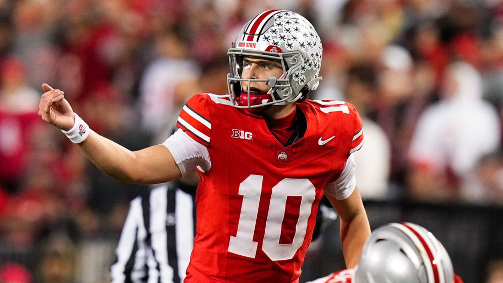 Ohio State Buckeyes quarterback Julian Sayin (10) speaks to his teammates in the second half of the NCAA college football game at Ohio Stadium on Saturday, Nov. 15, 2025 in Columbus, Ohio.