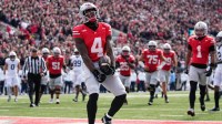 Ohio State Buckeyes wide receiver Jeremiah Smith (4) celebrates a touchdown during the NCAA football game against the Penn State Nittany Lions at Ohio Stadium