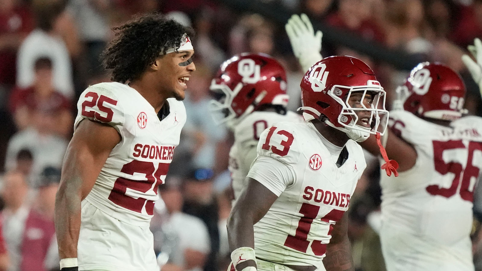 Oklahoma Sooners defensive back Michael Boganowski (25) and defensive back Reggie Powers III (13) yell to teammates after they stopped the Alabama Crimson Tide on a fourth down play to seal their victory at Saban Field at Bryant-Denny Stadium. Oklahoma defeated Alabama 23-21.