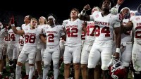 The Oklahoma Sooners celebrate after defeating the Alabama Crimson Tide at Saban Field at Bryant-Denny Stadium