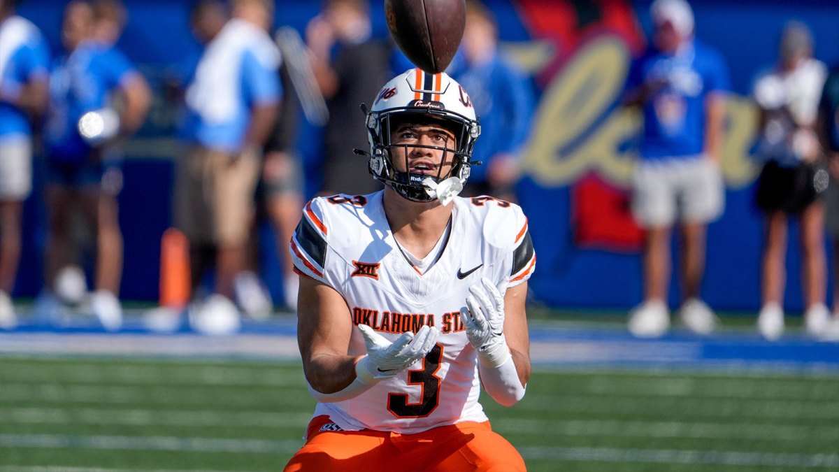 Oklahoma State running back Sesi Vailahi (3) warms up before an NCAA football game between Oklahoma State and Tulsa.