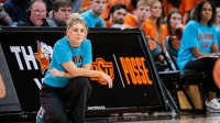 Oklahoma State Cowgirls coach Jaycie Hoyt watches game play during the first half against the Oral Roberts Golden Eagles.