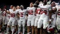 The Oklahoma Sooners celebrate after defeating the Alabama Crimson Tide at Saban Field at Bryant-Denny Stadium.