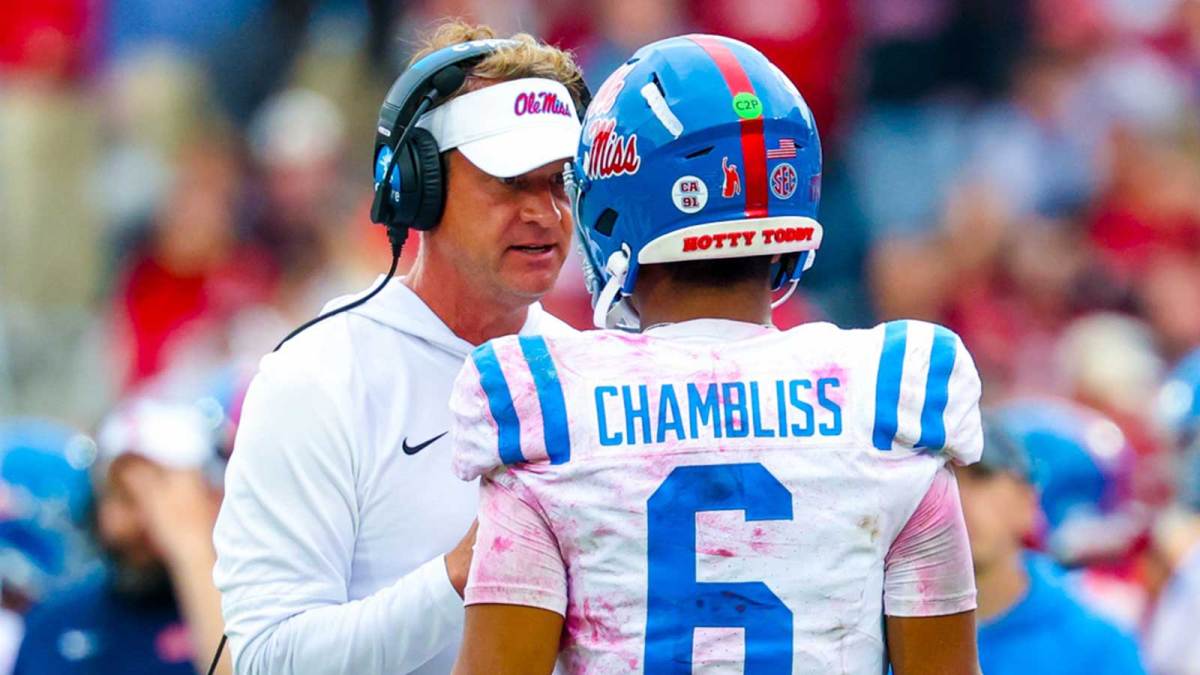 Ole Miss Rebels head coach Lane Kiffin speaks with Ole Miss Rebels quarterback Trinidad Chambliss (6) during the second half at Gaylord Family-Oklahoma Memorial Stadium.