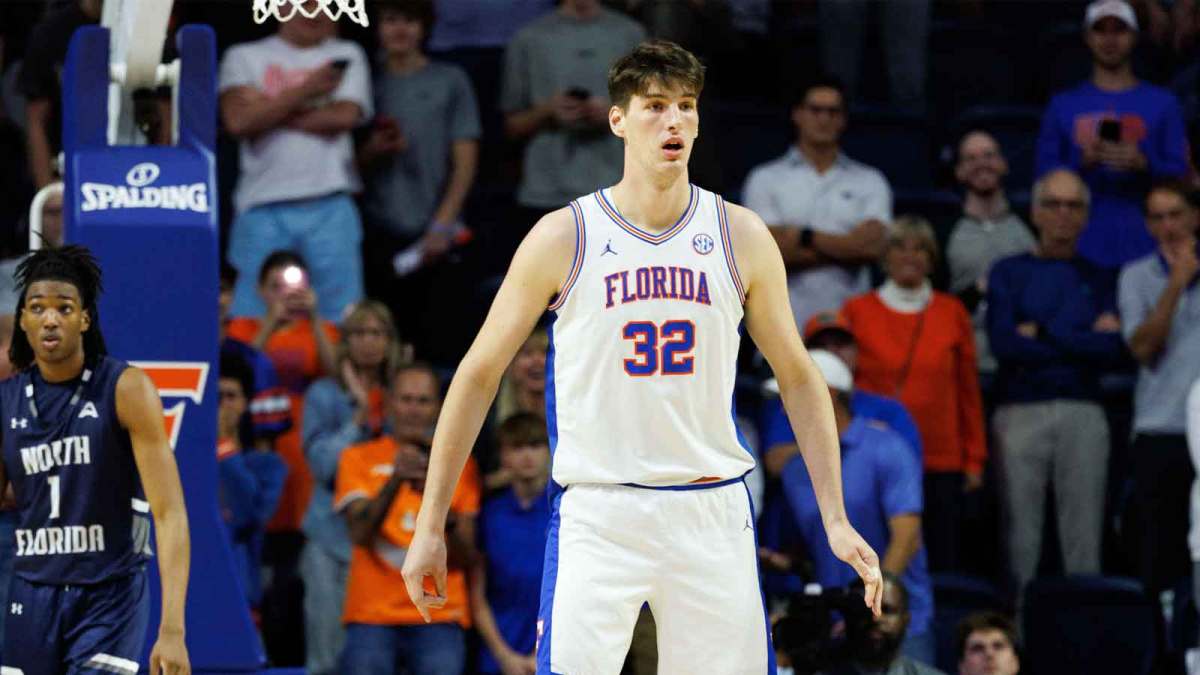 Florida Gators center Olivier Rioux (32) defends while North Florida Ospreys forward BJ Plummer (1) looks on during the second half at Exactech Arena at the Stephen C. O'Connell Center.