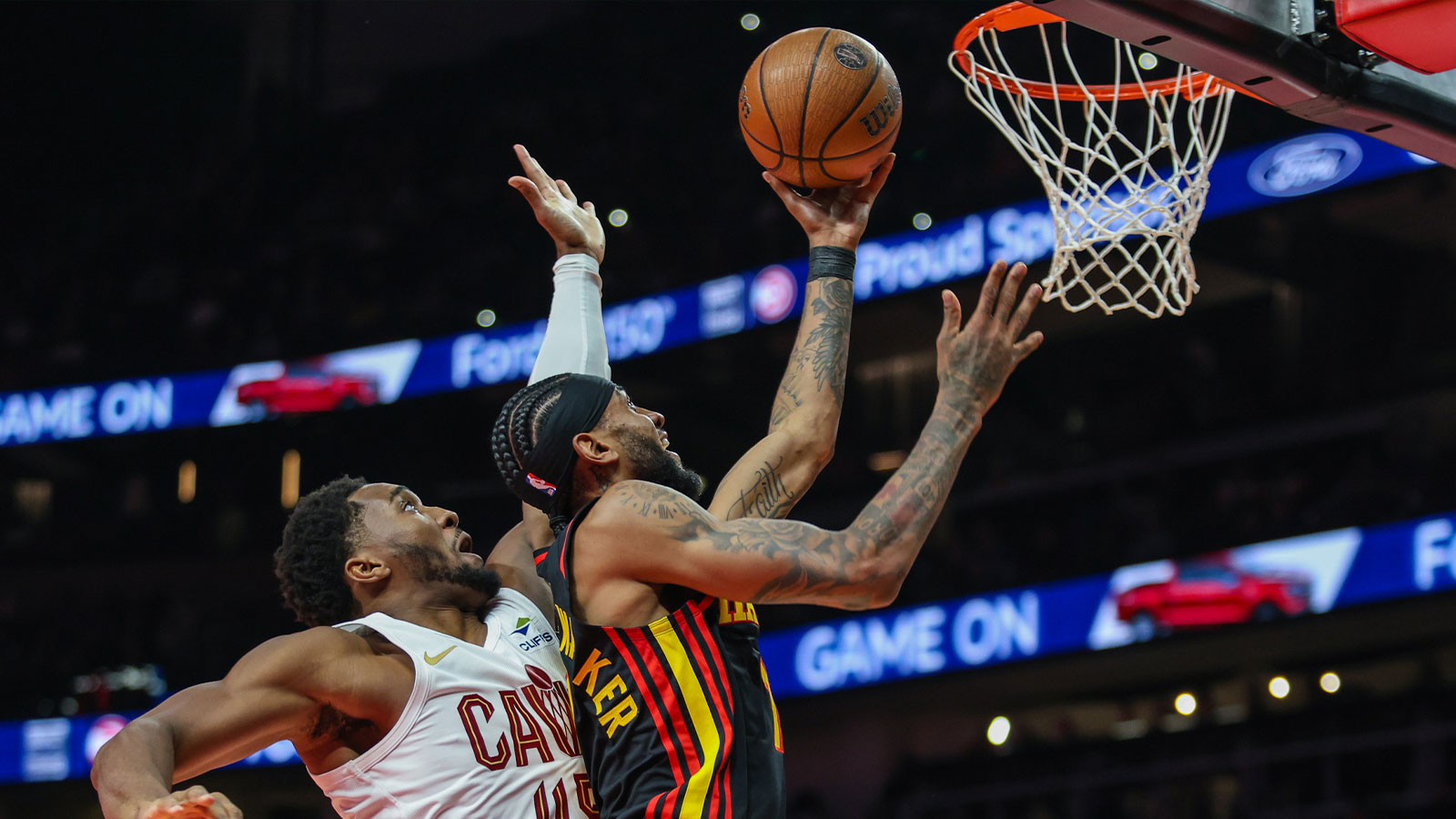 Atlanta Hawks guard Nickeil Alexander-Walker (7) shoots the ball against Cleveland Cavaliers guard Donovan Mitchell (45) during the first quarter at State Farm Arena.