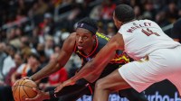 Atlanta Hawks forward Onyeka Okongwu (17) protects the ball against Cleveland Cavaliers center Evan Mobley (4) during the second quarter at State Farm Arena.