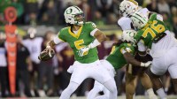 Oregon Ducks quarterback Dante Moore (5) throws a pass for a first down during the first half against the Minnesota Golden Gophers at Autzen Stadium.